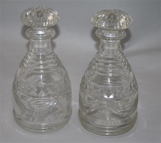 A pair of Regency Irish cut glass mallet form decanters and stoppers, height 25cm